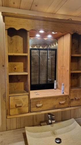 a bathroom with a sink and a mirror at Le montagnard in Lullin
