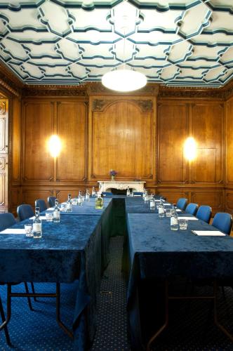a large conference room with a long table with chairs at Wortley Hall Sheffield in Sheffield