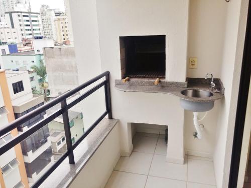 Apartamento Balneário Camboriú TV 또는 엔터테인먼트 센터