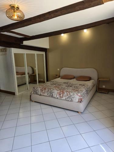 a bedroom with a bed in a room at domaine grangieras in Château-lʼÉvêque