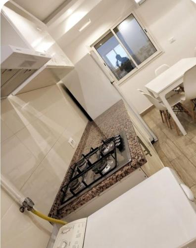 an aerial view of a kitchen with a stove at Résidence Nour in Monastir