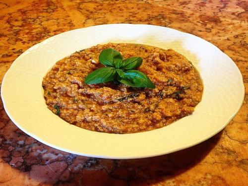 a white plate with a bowl of food on a table at Agriturismo Villa Dauphiné in Bagno a Ripoli