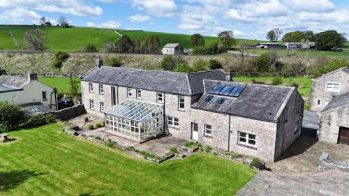 an aerial view of a large house with a conservatory at Estatesmen Lodge, Hillside Farm in Kirkby Stephen