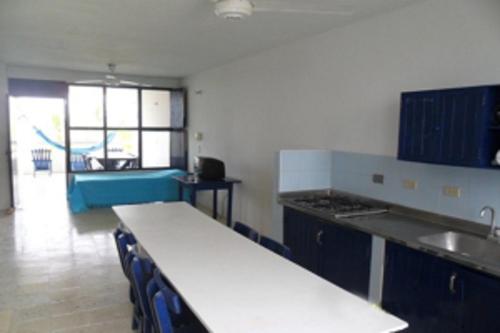 a kitchen with a counter top and a sink at Apartamentos Las Múcuras in Coveñas