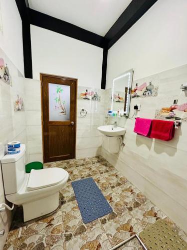 a bathroom with a toilet and a sink at The Bliss Homestay in Ella