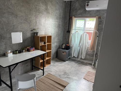 a home office with a desk and a window at Bird Nest in Ko Tao