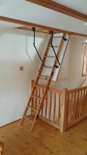 a wooden staircase in a room with a wooden floor at Chalupa Lužické hory in Dolní Světlá