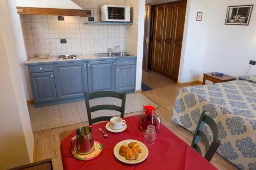 Kuchyň nebo kuchyňský kout v ubytování Residence Les Nigritelles