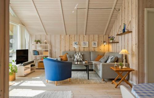 a living room with a couch and a table at Awesome Home In Ulfborg With Wifi in Ulfborg