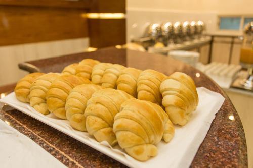 a plate of croissants sitting on a table at Hotel White Pearl in Pokhara