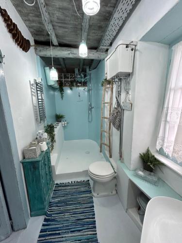 a bathroom with a toilet and a tub and a sink at Villa Ochre - Rustic Retreat in Tsilivi