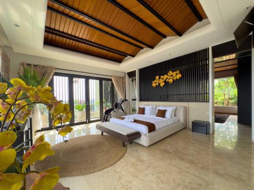 a living room with a white couch and a table at Depari Dago Villa in Bandung