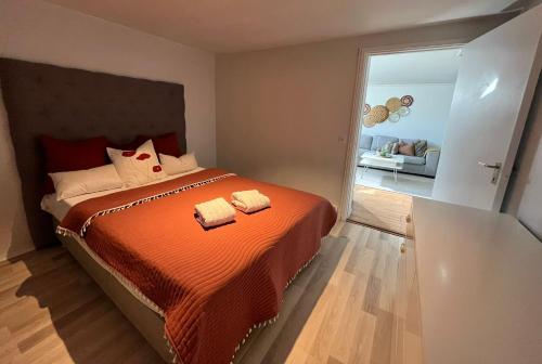 a bedroom with a bed with two towels on it at Joselia in Falkenberg
