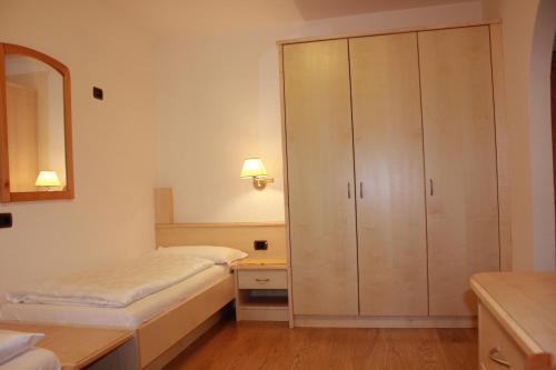 Postel nebo postele na pokoji v ubytování Hotel Garni Snaltnerhof