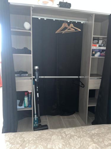 a closet with a door in a room at Le petit Vittel in Vittel