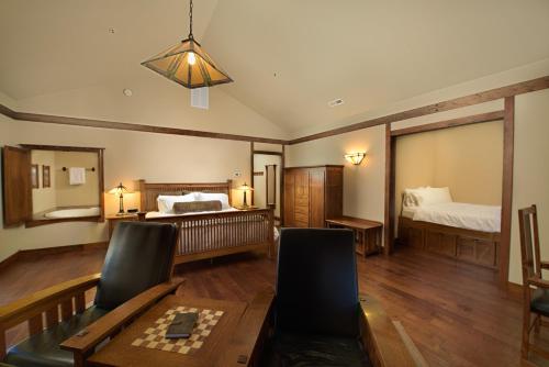 a living room with a bed and a dining table at FivePine Lodge in Sisters