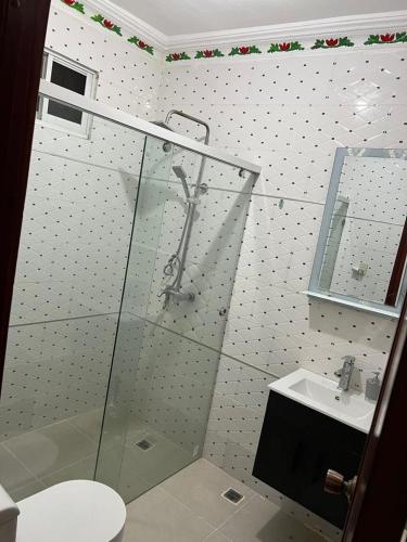 a bathroom with a glass shower and a sink at Boutique Hotel in Pedernales
