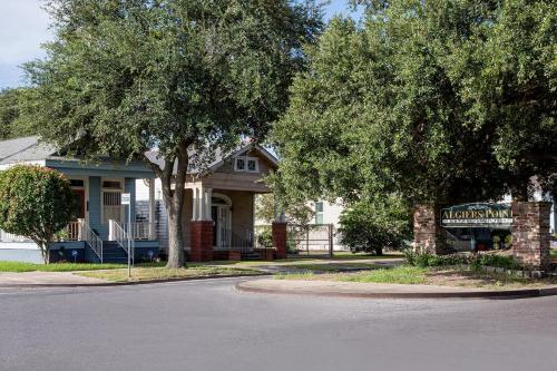 a house with a sign in front of it at Federal City Inn & Suites in New Orleans