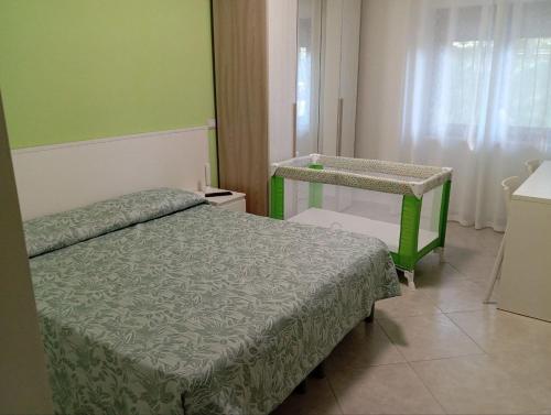 a small bedroom with a bed and a table at Bed and Breakfast Arcobaleno - Rieti in Rieti