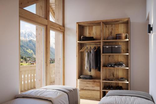 a bedroom with a closet with a view of a mountain at Ma Chérie in Livigno