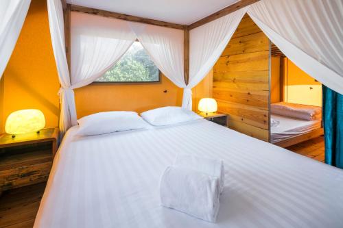 Ένα ή περισσότερα κρεβάτια σε δωμάτιο στο Casa Tuia Resort