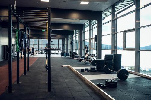 a gym with lots of windows and people in the background at Holiday Club Åre in Åre