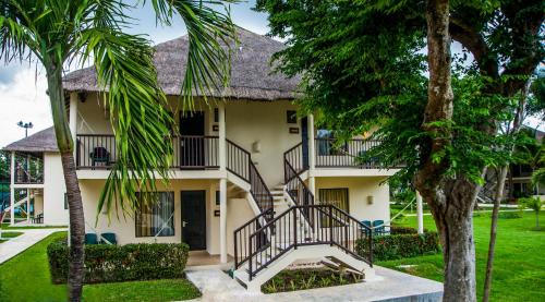 a house with a staircase in front of it at Allegro Playacar - All Inclusive Resort in Playa del Carmen
