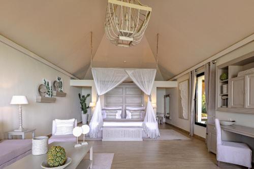 a living room with a couch and a table at Zawadi Hotel, Zanzibar in Michamvi