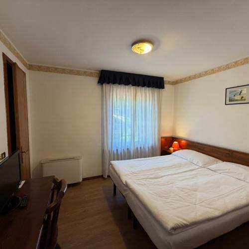 Llit o llits en una habitació de Single Rooms
