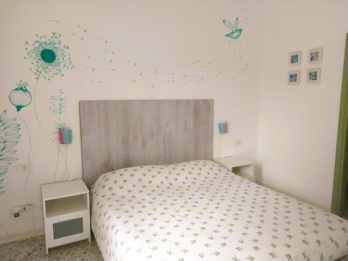 a bedroom with a bed with stars on the wall at B&B Casa Corbezzolo in Procchio