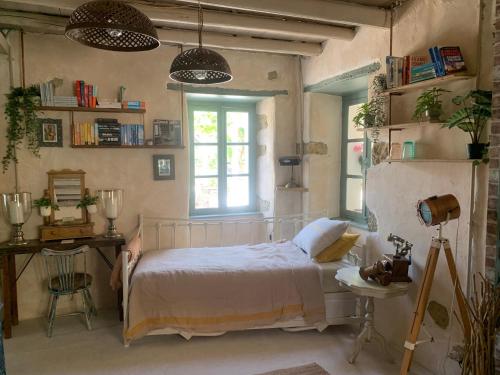 a bedroom with a white bed and a window at Villa Ochre - Rustic Retreat in Tsilivi