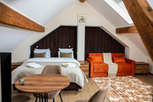 a bedroom with a bed and a table and chairs at Villa Bellevue Genève in Annemasse
