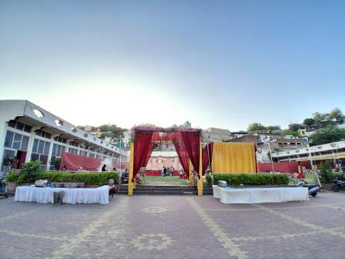 a stage in the middle of a parking lot at The JANAKPURI in Ajmer