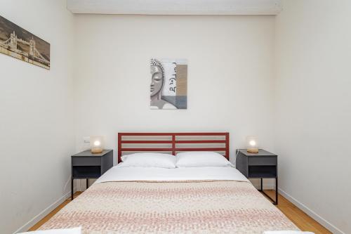 a bedroom with a large bed with two night stands at CityLife in Bergamo