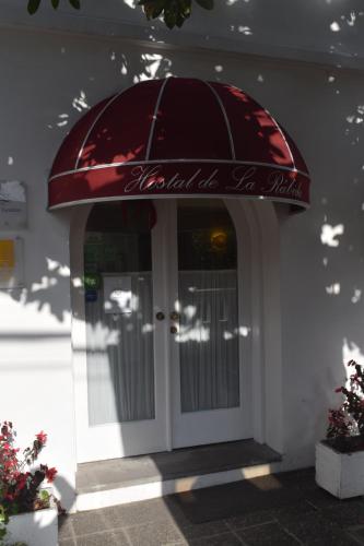 a entrance to a building with a red dome over the door at La Rabida Hotel Boutique in Quito