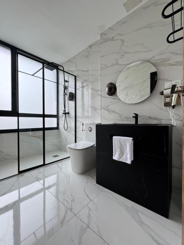 a bathroom with a sink and a toilet and a mirror at Boutique Palacio in Alicante