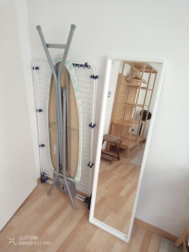 a mirror in a room next to a door at Central 2, nice two room apartment, free bus, city tax included in Lucerne