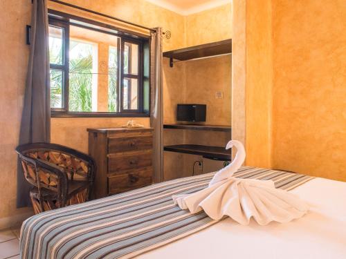 Postel nebo postele na pokoji v ubytování Hotel Barrio Latino