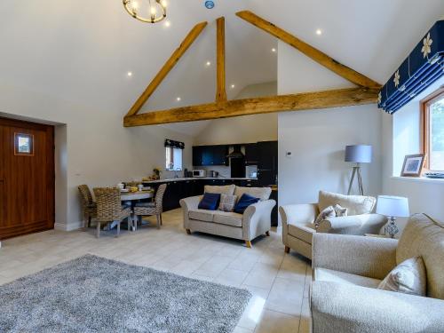 a living room with couches and a dining room at The Wheat Store - Uk32649 in Elston