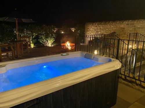 a hot tub in a backyard at night at The Richmond - Uk40459 in Newsham