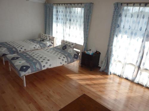 Ein Bett oder Betten in einem Zimmer der Unterkunft Sora-mame