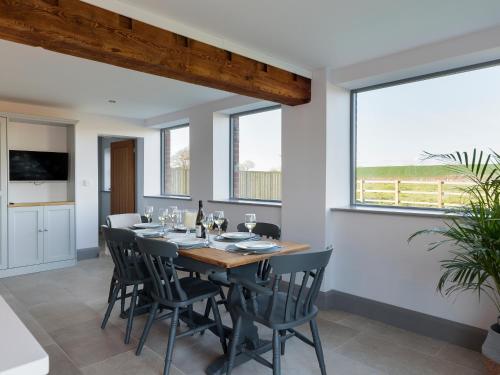 a dining room with a table and chairs at The Maddocks - Uk36311 in Whitchurch