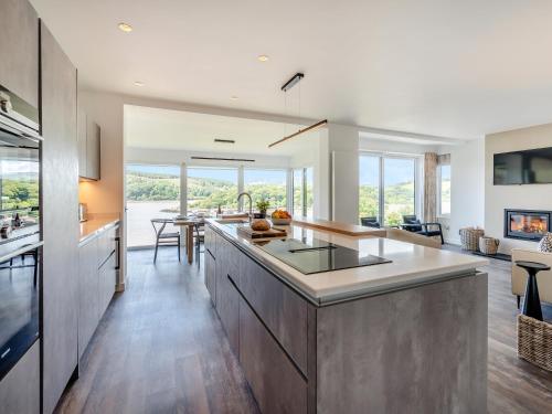 a kitchen with a large island in the middle at Berkeley in Kippford