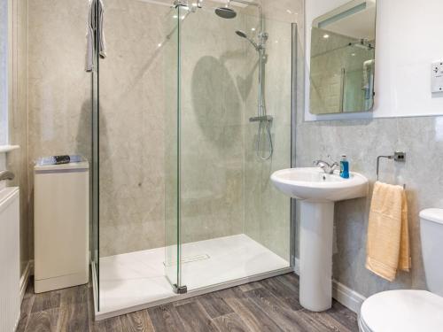 a bathroom with a shower and a sink at The Gables in Bridlington