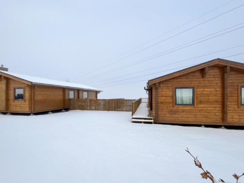 a couple of buildings with snow on the ground at Coo Lodge - Uk48430 in Falkirk