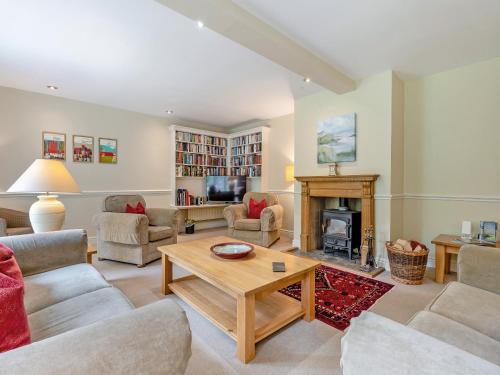 a living room filled with furniture and a fireplace at Coach House - Uk49887 in Preston