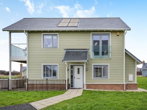 a house with a solar panel on top of it at Stargazer in Beadnell