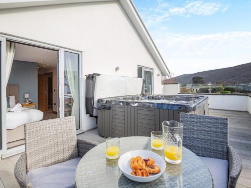 a table with a bowl of food on a patio at Hafod Y Morfa - Uk48829 in Harlech