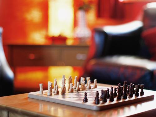 a chess board on top of a table at Bwthyn Onnen-Oa5 in Ystrad Meurig