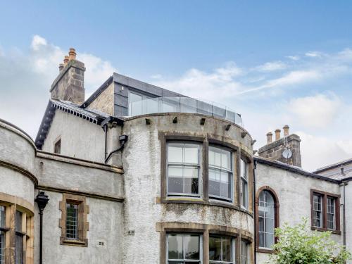 an old building with a glass dome on top of it at Cragdale Penthouse in Settle